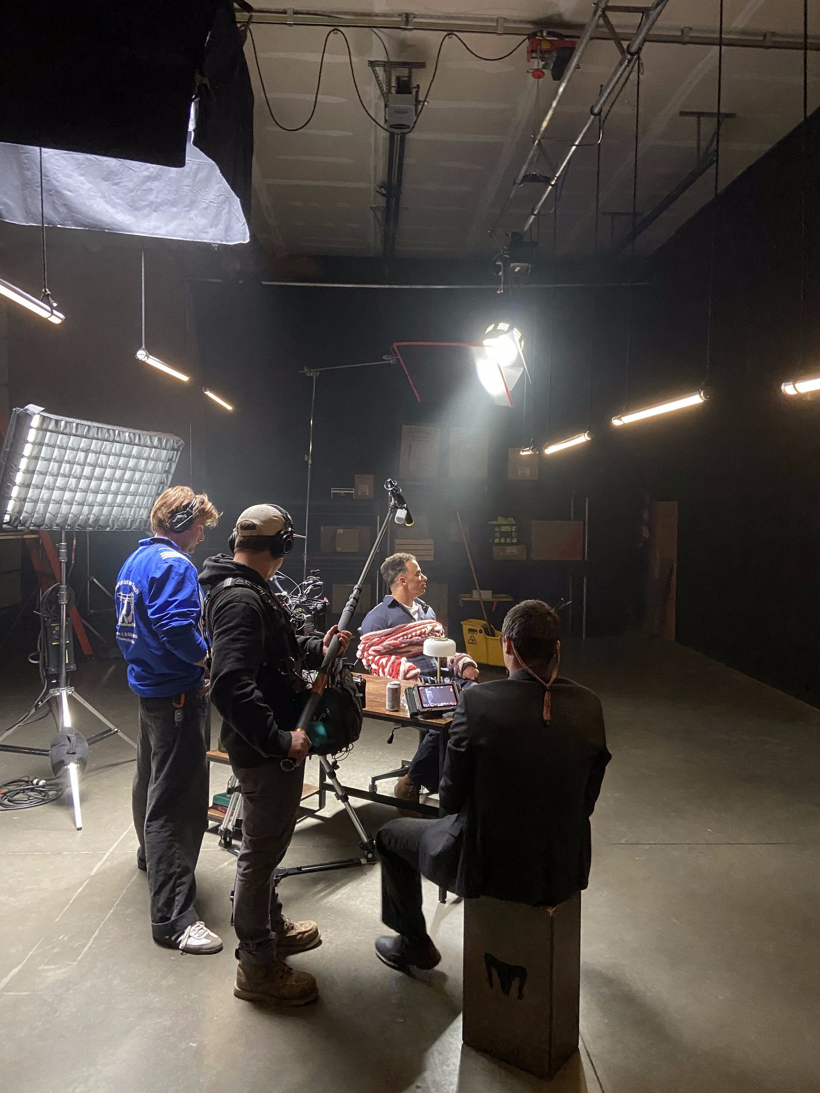 Wide behind-the-scenes shot of the crew working on set during the 48 Hour Film Project shoot